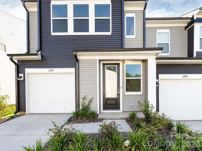 2108 Endeavor Run, Charlotte, NC 28269.  MLS# CAR4318966, YatesRealty ID 12171. Covered Front Entry and Front Load Garage. 