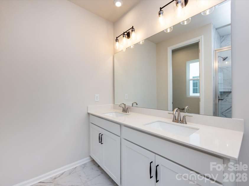 2108 Endeavor Run, Charlotte, NC 28269.  MLS# CAR4318966, YatesRealty ID 12171. Dual Vanity at Primary Bath with Loads of Storage.