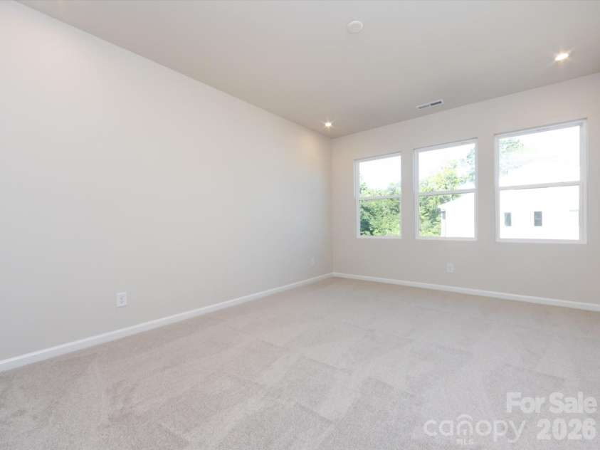 2108 Endeavor Run, Charlotte, NC 28269.  MLS# CAR4318966, YatesRealty ID 12171. Primary Suite with Wall of Windows Warming the Space with Natural Light.