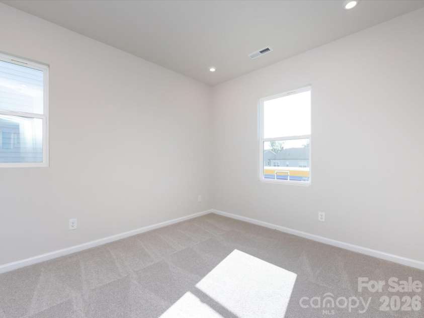 2108 Endeavor Run, Charlotte, NC 28269.  MLS# CAR4318966, YatesRealty ID 12171. Secondary Bedroom with Loads of Light.