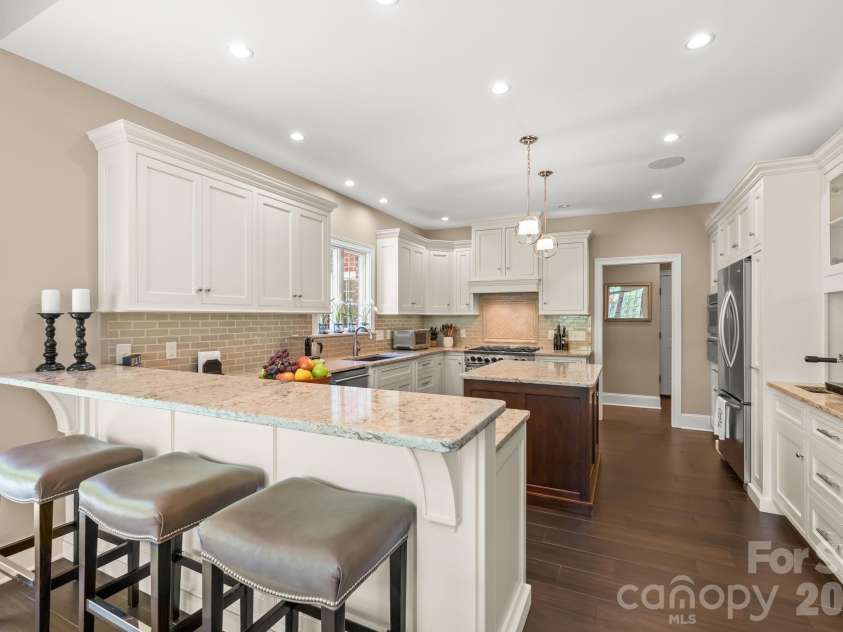 11555 Double Spring Road, Lewisville, NC 27023.  MLS# CAR4370300, YatesRealty ID 12175. Chefs kitchen with 6 burner gas range and double oven