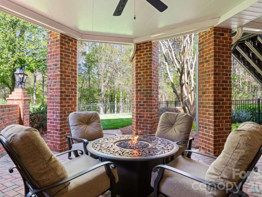 11555 Double Spring Road, Lewisville, NC 27023.  MLS# CAR4370300, YatesRealty ID 12175. Lower level patio with extensive lighting
