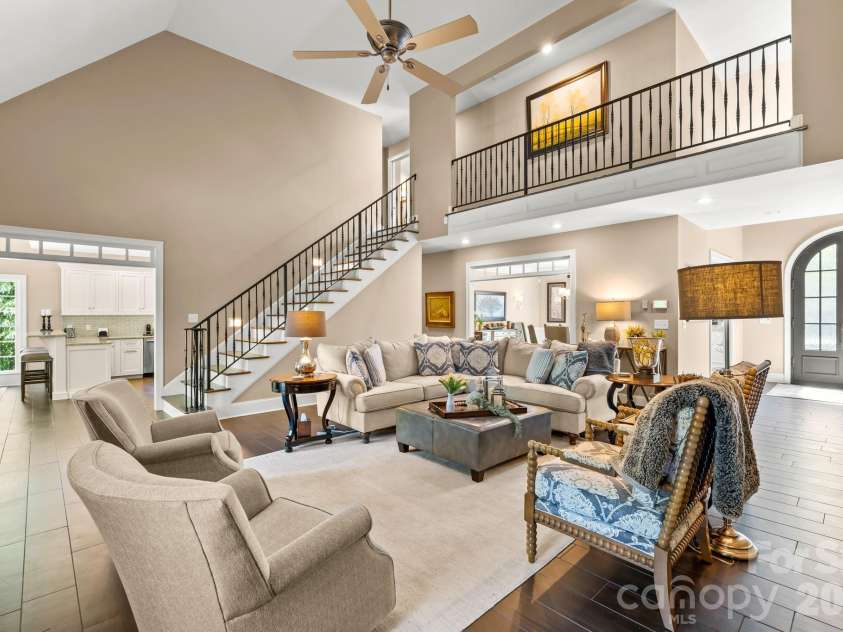 11555 Double Spring Road, Lewisville, NC 27023.  MLS# CAR4370300, YatesRealty ID 12175. Soaring vaulted ceilings and oversized windows with a custom iron railing to the open 2nd floor balcony