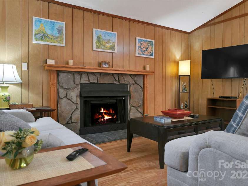 177 Walelu Court, Brevard, NC 28712.  MLS# CAR4333562, YatesRealty ID 1218. Cozy gas log fireplace. It was originally a wood burning fireplace.