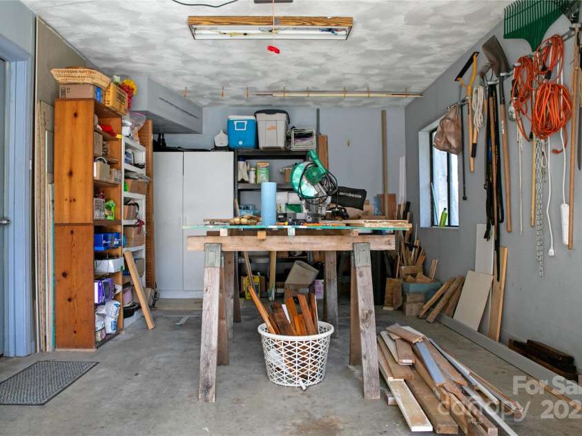 177 Walelu Court, Brevard, NC 28712.  MLS# CAR4333562, YatesRealty ID 1218. Single car garage can be used as a workshop area.