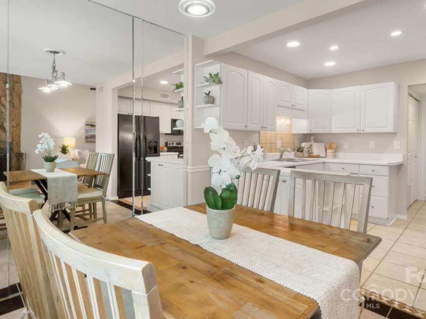 8326 Ramath Drive, Charlotte, NC 28211.  MLS# CAR4250067, YatesRealty ID 12182. Dining area flows into spacious bright white kitchen