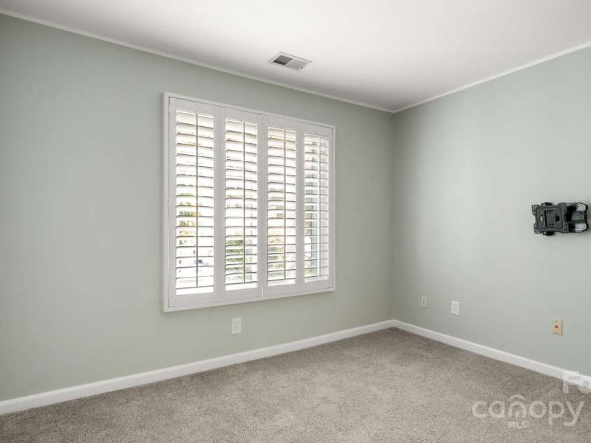 8326 Ramath Drive, Charlotte, NC 28211.  MLS# CAR4250067, YatesRealty ID 12182. Downstairs bedroom with tv mount