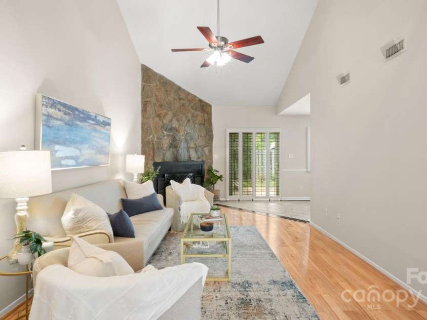 8326 Ramath Drive, Charlotte, NC 28211.  MLS# CAR4250067, YatesRealty ID 12182. Living space with light laminate wood-look flooring