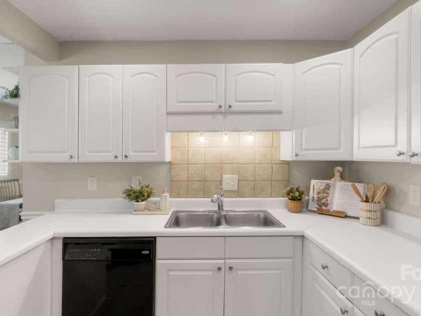 8326 Ramath Drive, Charlotte, NC 28211.  MLS# CAR4250067, YatesRealty ID 12182. Plenty of storage in this bright white kitchen