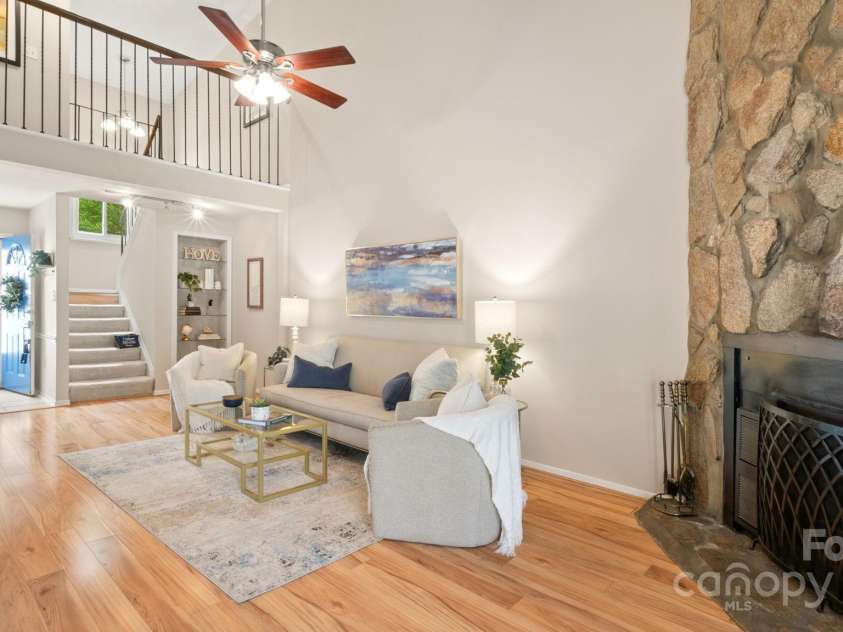 8326 Ramath Drive, Charlotte, NC 28211.  MLS# CAR4250067, YatesRealty ID 12182. Stunning two story living room opens to upstairs cat walk leading to upstairs beds & baths. Notice the built-in bookcase!