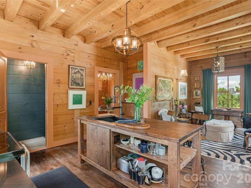 106 McCauley Drive, Asheville, NC 28803.  MLS# CAR4366972, YatesRealty ID 12192. Kitchen looking into den which can also be used as a dining area