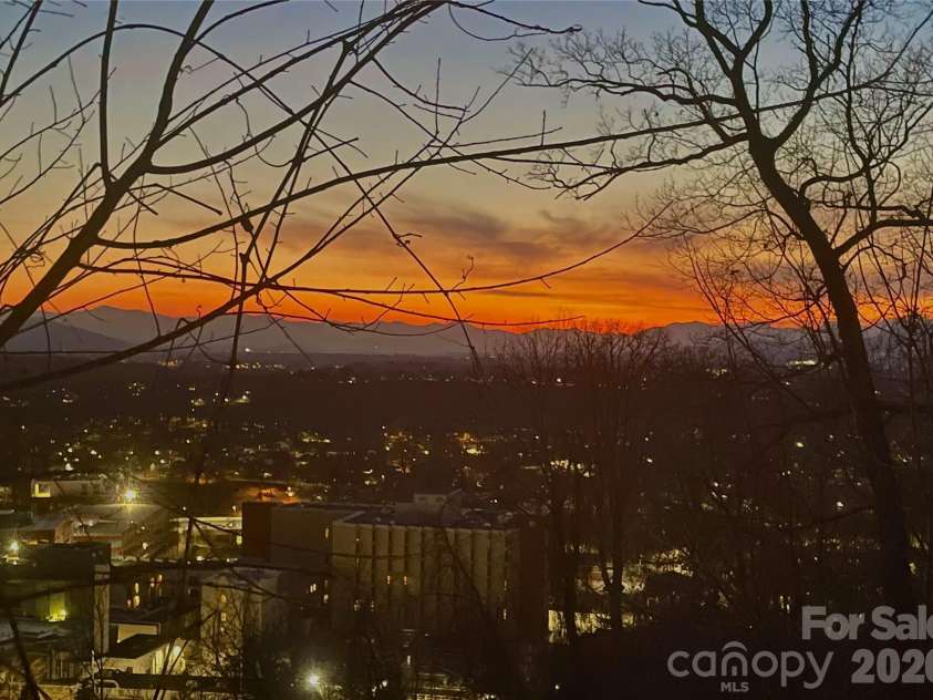 106 McCauley Drive, Asheville, NC 28803.  MLS# CAR4366972, YatesRealty ID 12192. Winter sunset