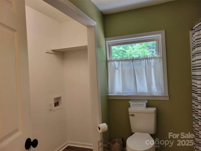 3634 Cartledge Creek Road, Mount Gilead, NC 27306.  MLS# CAR4253868, YatesRealty ID 12197. Bathroom w Laundry closet