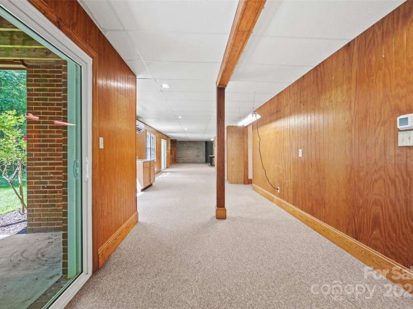 7103 Forest Ridge Road, Matthews, NC 28104.  MLS# CAR4255751, YatesRealty ID 12216. Walk-out basement