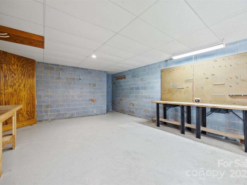 7103 Forest Ridge Road, Matthews, NC 28104.  MLS# CAR4255751, YatesRealty ID 12216. Workshop area of walk-out basement
