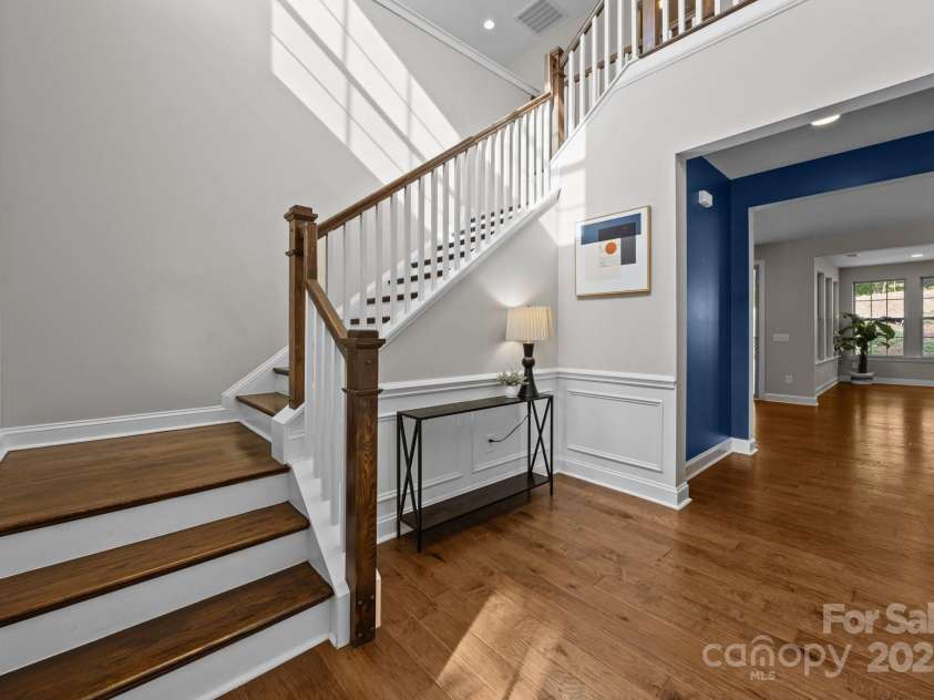 11304 Preservation Lane, Charlotte, NC 28278.  MLS# CAR4249820, YatesRealty ID 12218. Inside the front door you'll find a a two story foyer, beautiful hardwood floors throughout the main level, up the stairs and in the loft area!