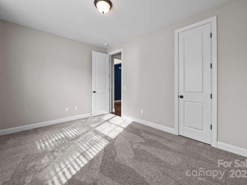 11304 Preservation Lane, Charlotte, NC 28278.  MLS# CAR4249820, YatesRealty ID 12218. Main level bedroom with closet and new carpet