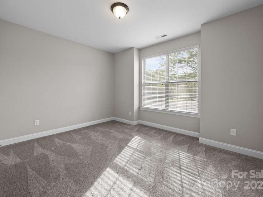 11304 Preservation Lane, Charlotte, NC 28278.  MLS# CAR4249820, YatesRealty ID 12218. Main level bedroom with new carpet