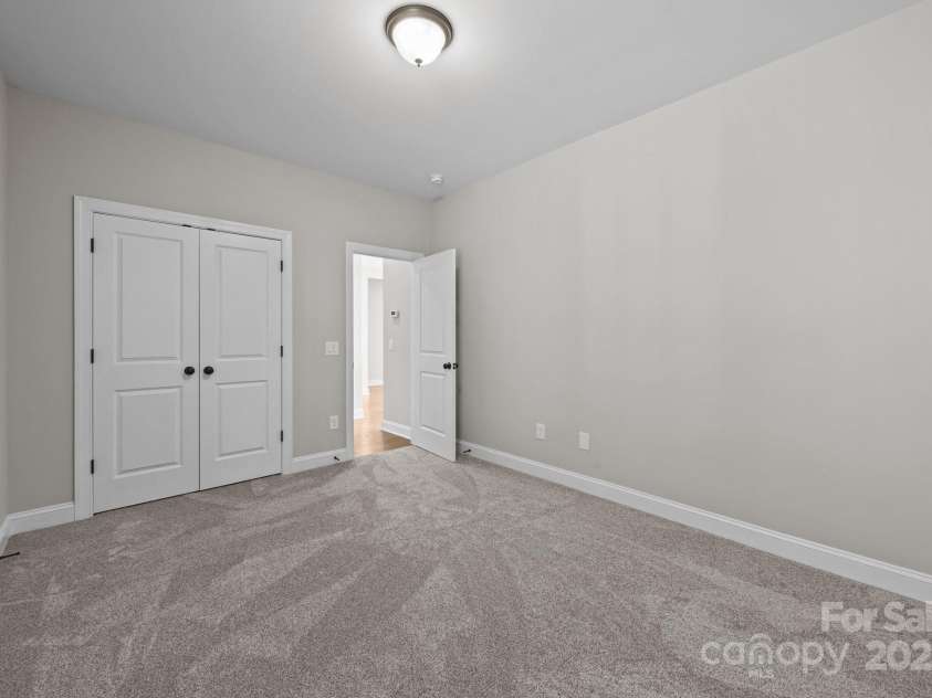 11304 Preservation Lane, Charlotte, NC 28278.  MLS# CAR4249820, YatesRealty ID 12218. Secondary bedroom (bedroom 3) with brand new carpet