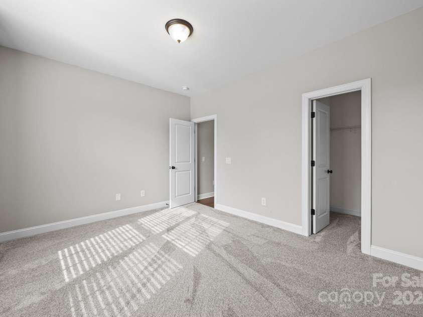 11304 Preservation Lane, Charlotte, NC 28278.  MLS# CAR4249820, YatesRealty ID 12218. Secondary bedroom (bedroom 5) with brand new carpet