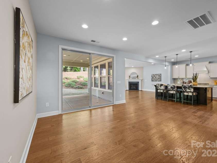 11304 Preservation Lane, Charlotte, NC 28278.  MLS# CAR4249820, YatesRealty ID 12218. The dining room has huge solid sliders that open out to the covered porch!