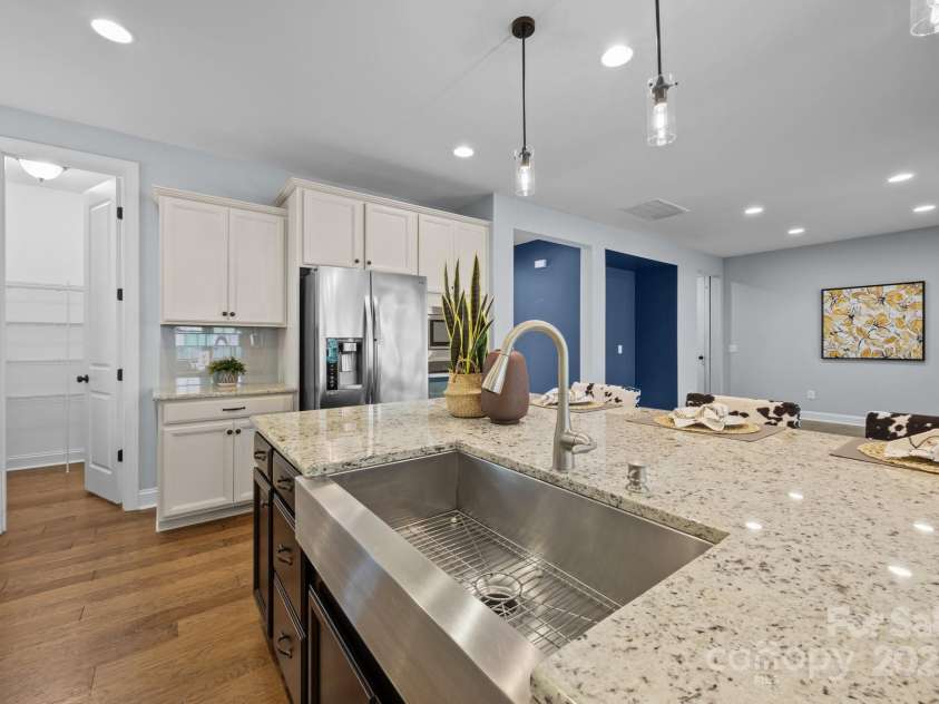 11304 Preservation Lane, Charlotte, NC 28278.  MLS# CAR4249820, YatesRealty ID 12218. The kitchen features a stunning stainless farmhouse sink!