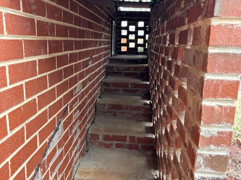 503 9th Avenue, Conover, NC 28613.  MLS# CAR4352494, YatesRealty ID 12226. Covered breezeway for the pet door