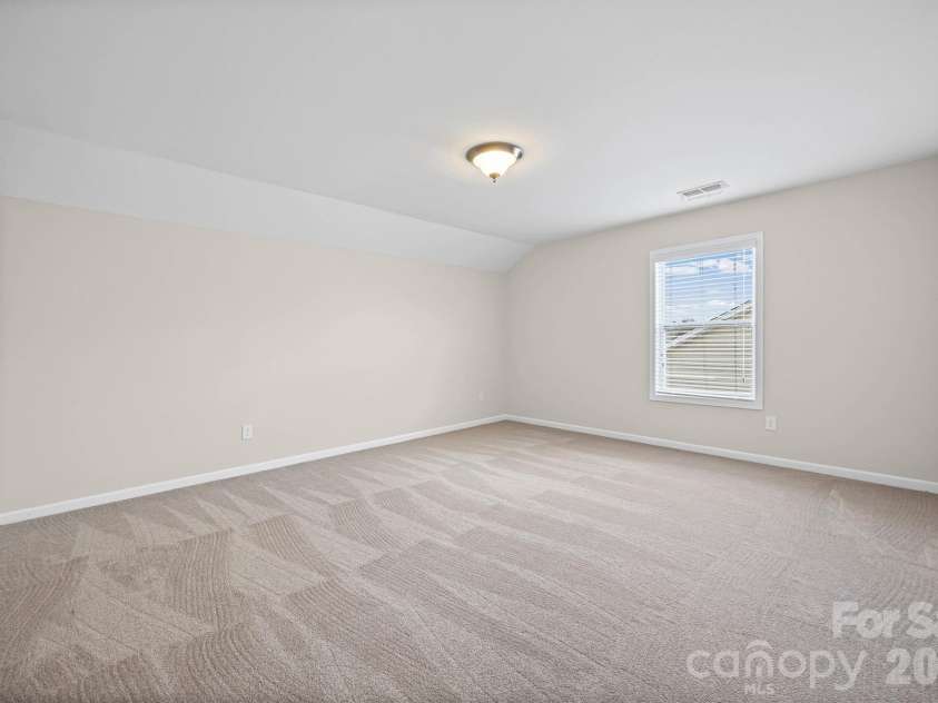 1129 Black Walnut Road, Clover, SC 29710.  MLS# CAR4334116, YatesRealty ID 12238. Upstairs bedroom #2 w/ walk-in closet (with attic access)