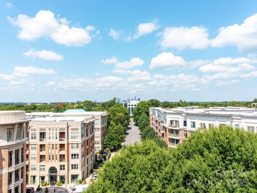 4620 Piedmont Row Drive, Charlotte, NC 28210.  MLS# CAR4300072, YatesRealty ID 1224. Rooftop terrace view of uptown CLT.