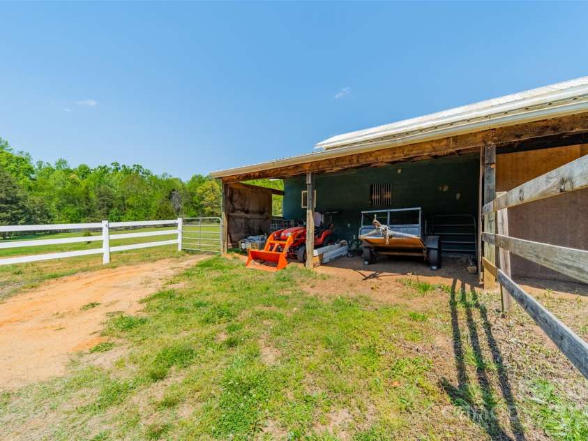 228 Red Dog Drive, Mooresville, NC 28115.  MLS# CAR4245955, YatesRealty ID 12253. Barn offers a side run-in shed access to small paddock or larger pastures