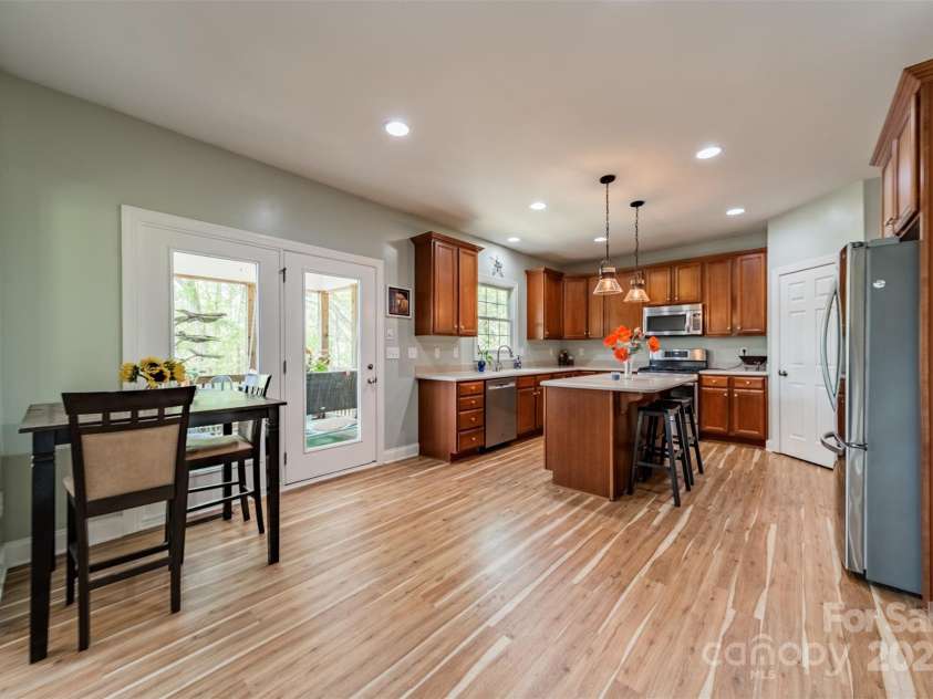 228 Red Dog Drive, Mooresville, NC 28115.  MLS# CAR4245955, YatesRealty ID 12253. Breakfast area off kichen, french doors open to screened porch