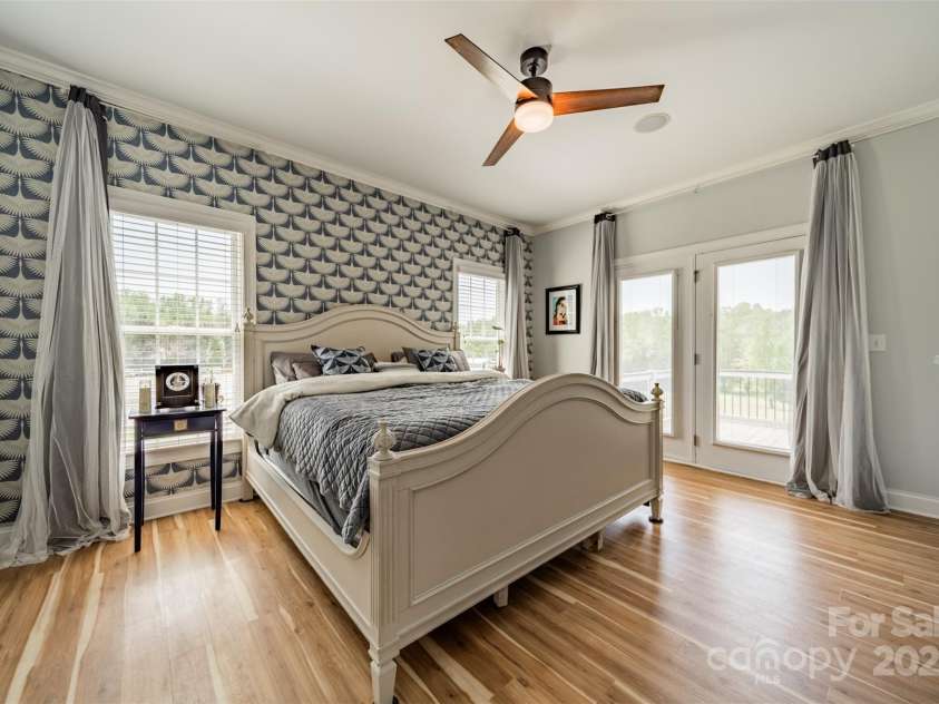 228 Red Dog Drive, Mooresville, NC 28115.  MLS# CAR4245955, YatesRealty ID 12253. Main floor primary suite w/French doors opening to back deck