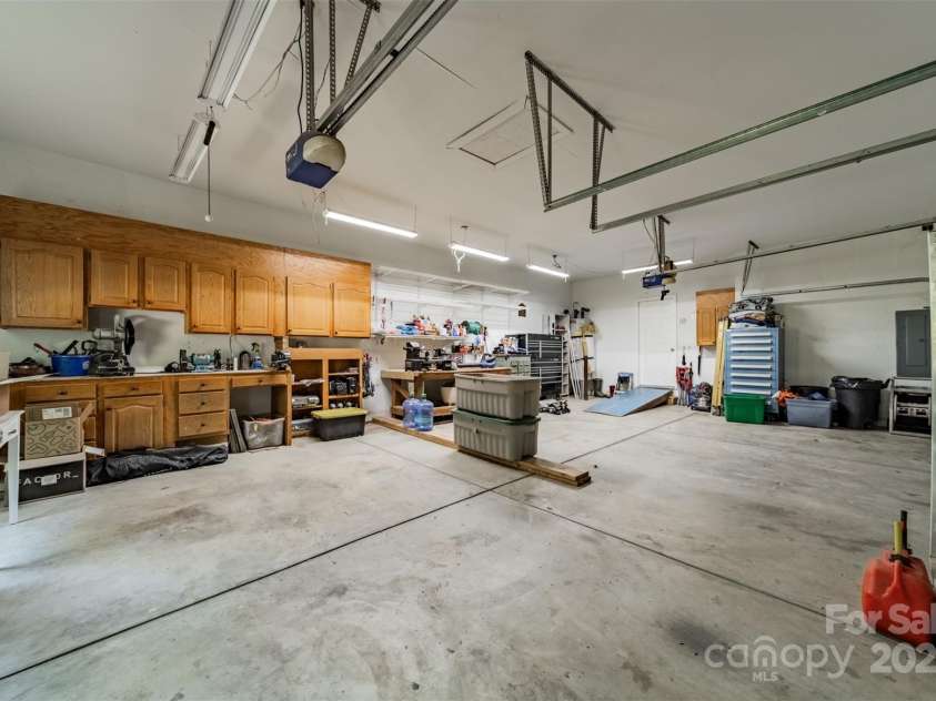 228 Red Dog Drive, Mooresville, NC 28115.  MLS# CAR4245955, YatesRealty ID 12253. Oversize 3 car garage and workshop w/benches and air from compressor in crawl space