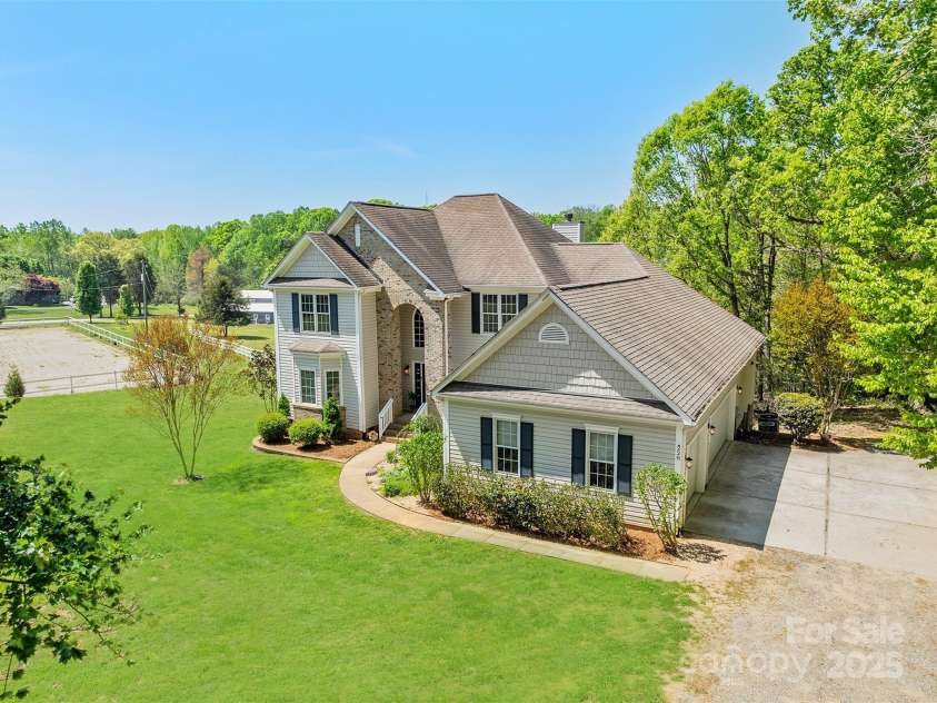 228 Red Dog Drive, Mooresville, NC 28115.  MLS# CAR4245955, YatesRealty ID 12253. Owner doesn't use chemicals on grass or plants, so we greened up the grass a little for you