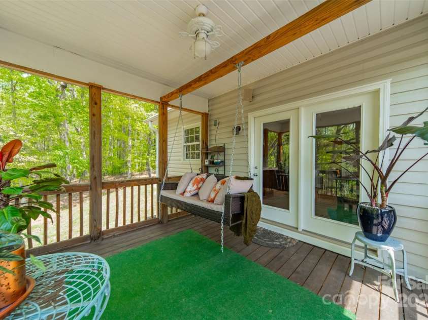228 Red Dog Drive, Mooresville, NC 28115.  MLS# CAR4245955, YatesRealty ID 12253. Screen porch overlooking the farm, swing included