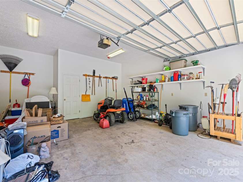 1192 Rockdale Road, Whittier, NC 28789.  MLS# CAR4239563, YatesRealty ID 12259. Inside large finished garage