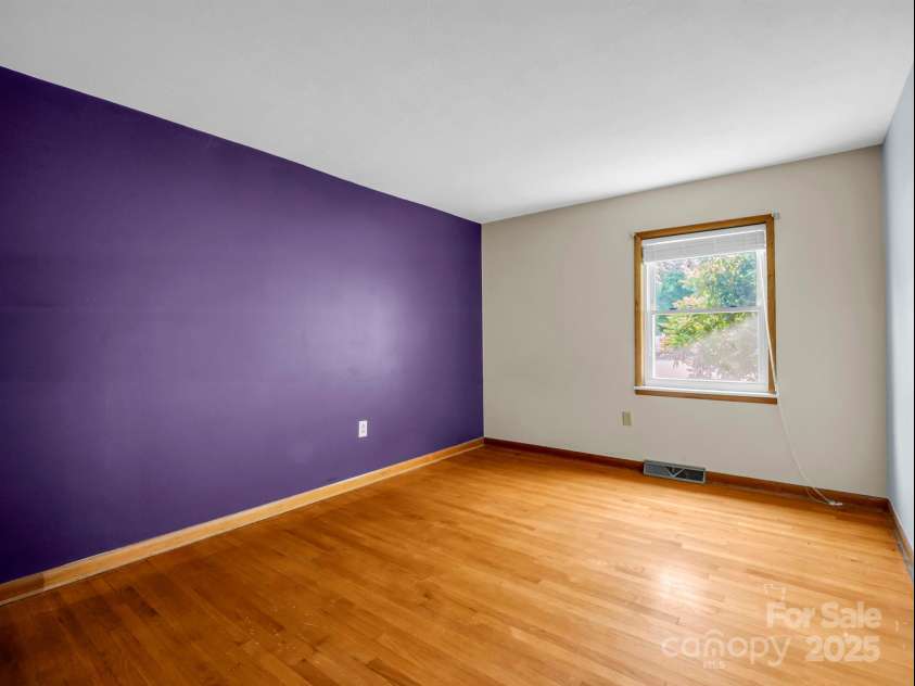 14 Monte Vista Place, Candler, NC 28715.  MLS# CAR4281379, YatesRealty ID 1226. Bedroom w/original oak hardwood floors