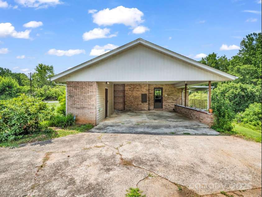 14 Monte Vista Place, Candler, NC 28715.  MLS# CAR4281379, YatesRealty ID 1226. Covered carport including storage room