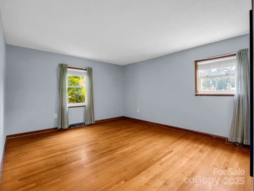 14 Monte Vista Place, Candler, NC 28715.  MLS# CAR4281379, YatesRealty ID 1226. Guest bedroom w/soft blue walls