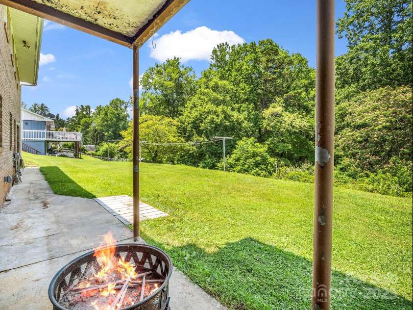14 Monte Vista Place, Candler, NC 28715.  MLS# CAR4281379, YatesRealty ID 1226. Rear patio w/fire pit