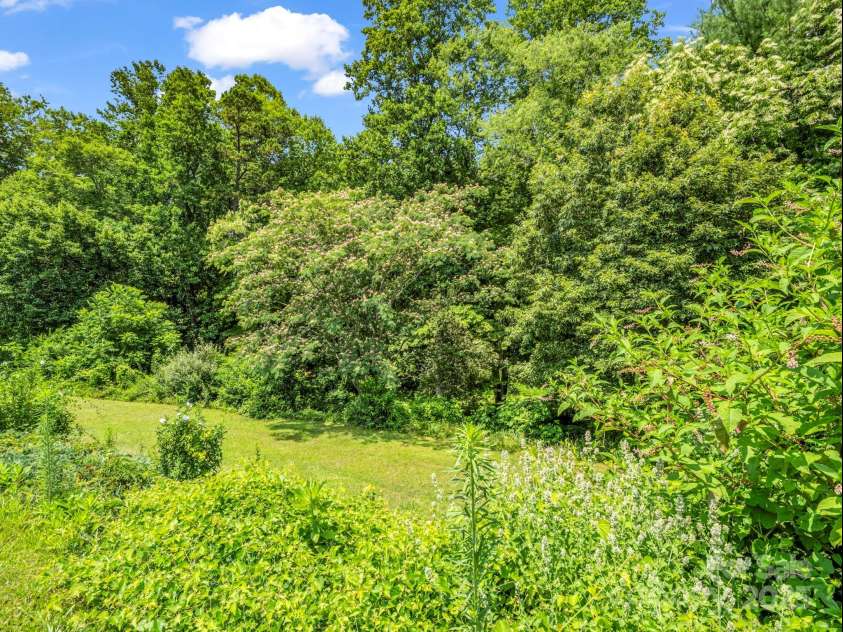 14 Monte Vista Place, Candler, NC 28715.  MLS# CAR4281379, YatesRealty ID 1226. Trees & privacy behind property