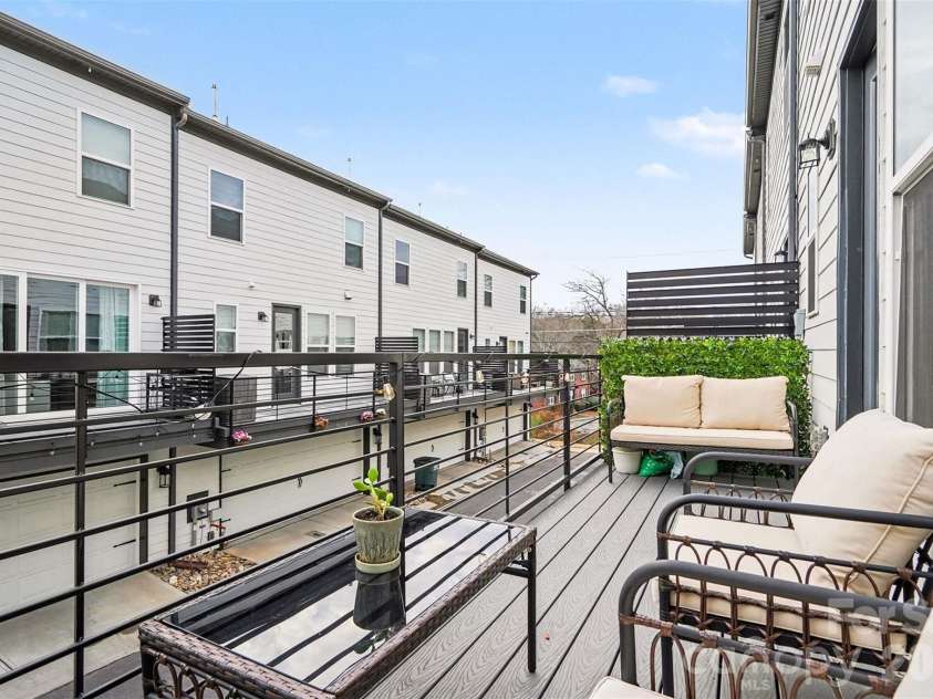 7017 Running Spring Drive, Charlotte, NC 28205.  MLS# CAR4346038, YatesRealty ID 12263. Balcony off kitchen