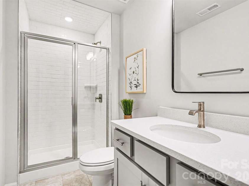 7017 Running Spring Drive, Charlotte, NC 28205.  MLS# CAR4346038, YatesRealty ID 12263. Lower level full bathroom