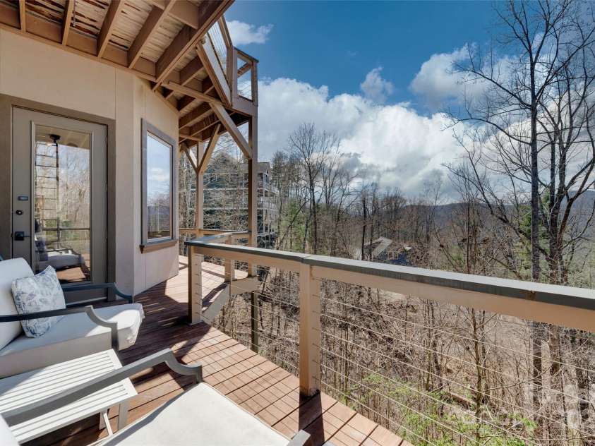 56 Chimney Crest Drive, Asheville, NC 28806.  MLS# CAR4235691, YatesRealty ID 12268. Deck on basement level