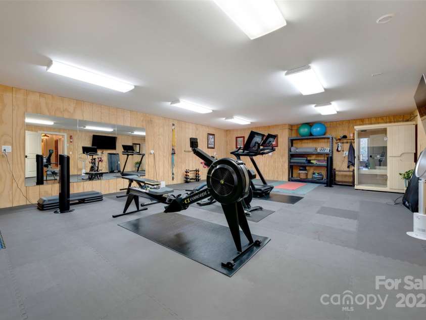 56 Chimney Crest Drive, Asheville, NC 28806.  MLS# CAR4235691, YatesRealty ID 12268. Gym in basement