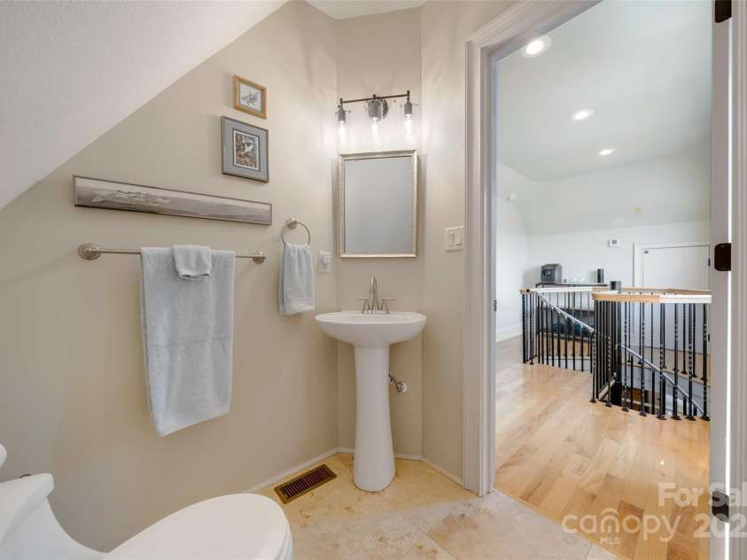 56 Chimney Crest Drive, Asheville, NC 28806.  MLS# CAR4235691, YatesRealty ID 12268. Half bath on third floor