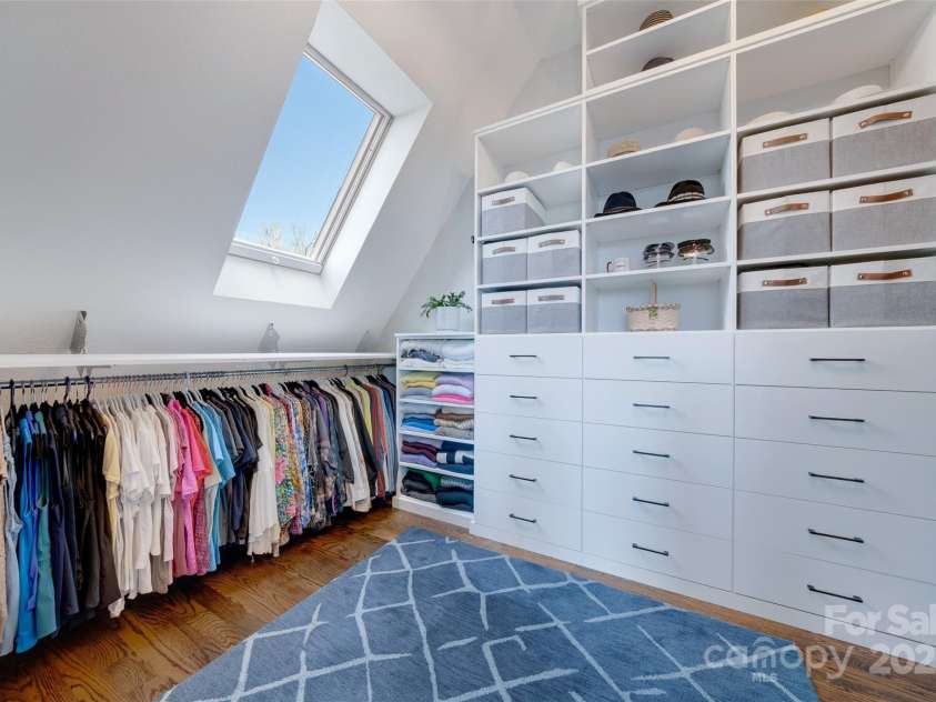56 Chimney Crest Drive, Asheville, NC 28806.  MLS# CAR4235691, YatesRealty ID 12268. Primary bedroom walk-in closet with custom shelving