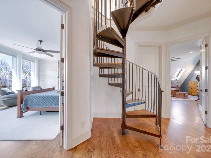 56 Chimney Crest Drive, Asheville, NC 28806.  MLS# CAR4235691, YatesRealty ID 12268. Spiral staircase to third floor