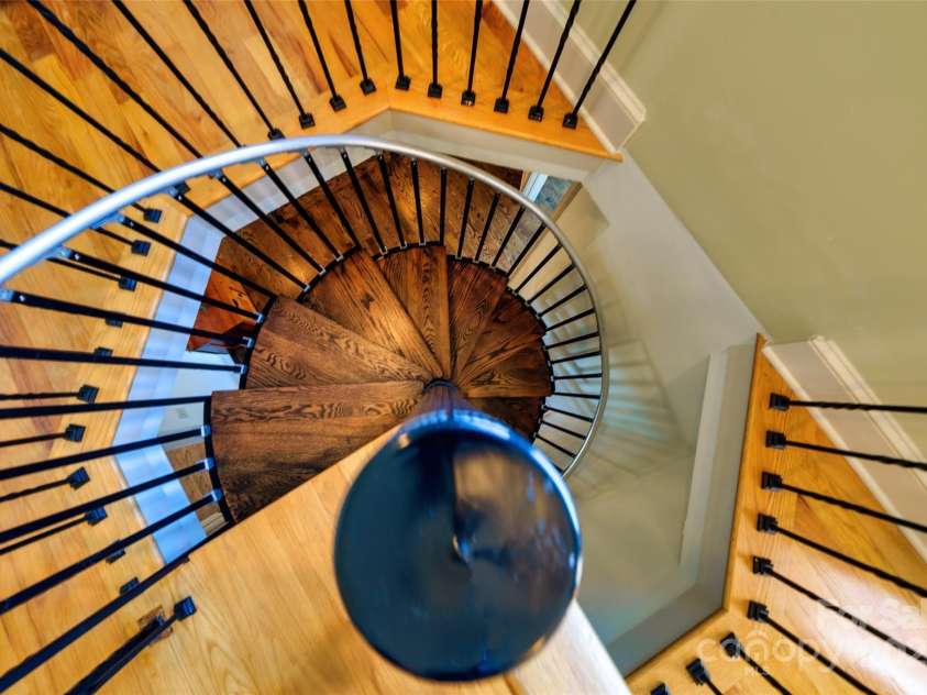 56 Chimney Crest Drive, Asheville, NC 28806.  MLS# CAR4235691, YatesRealty ID 12268. Spiral staircase to third floor