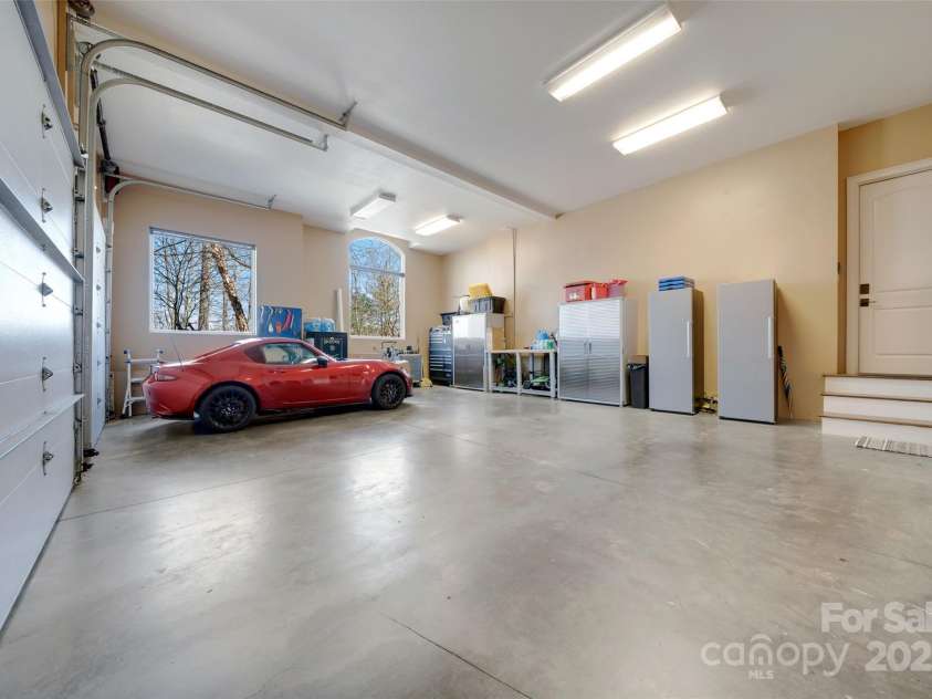 56 Chimney Crest Drive, Asheville, NC 28806.  MLS# CAR4235691, YatesRealty ID 12268. Three car garage on main level